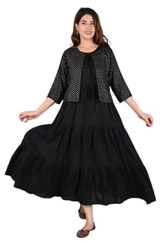 pregnant Woman wearing long black flared maxi dress paired with black polka dot jacket, three-quarter sleeves, and flat sandals, posing gracefully.